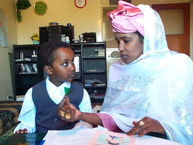HIPPY-trained mother working with her child. Photo courtesy HIPPY