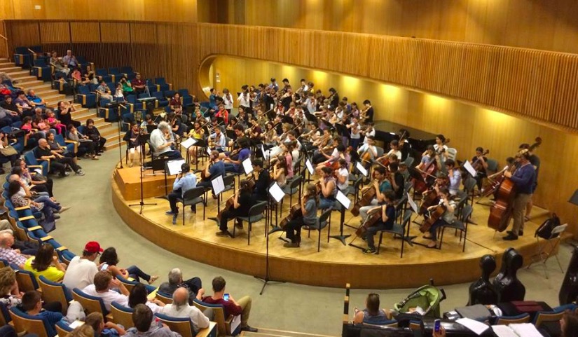 Itzhak Perlman conducts "Can Can" and Haydn's Toy Symphony with the Perlman Music Program Orchestra and 40 young Israeli String Players at the Israel Conservatory Tel Aviv. Photo courtesy The Perlman Music Program