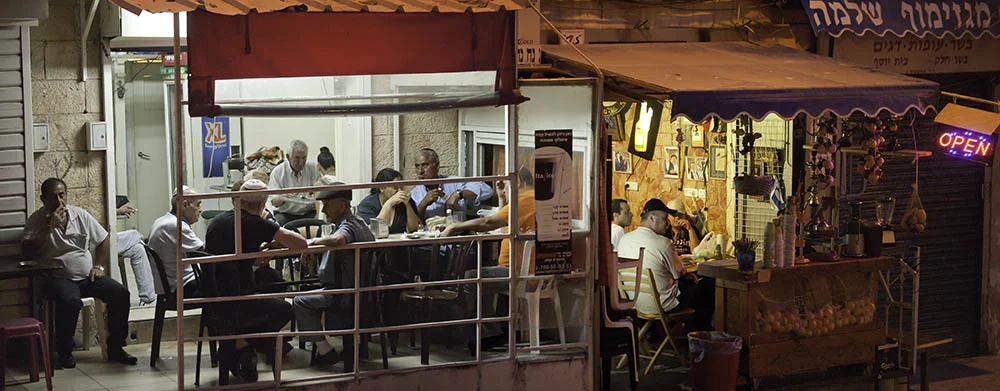 Socializing at Jerusalem’s Machane Yehuda in the evening. Photo by and © Vision Studio