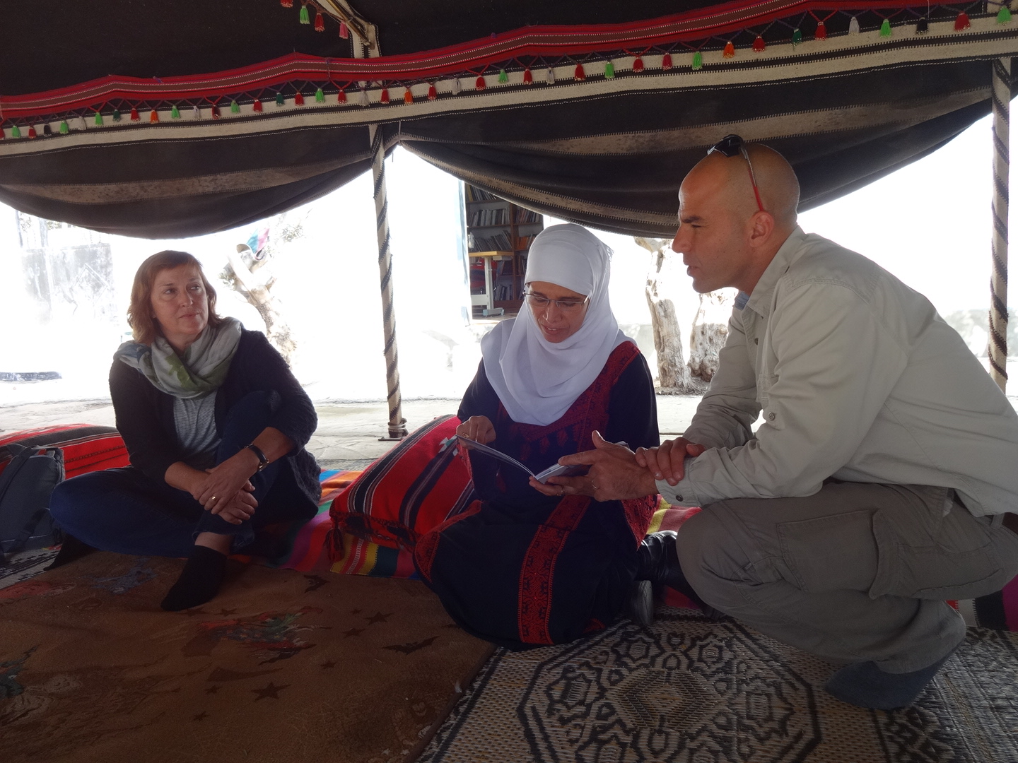 Diana with our guide, Jossef Idan, and Na'ama ElSana of the Women's Embroidery Project at Lakiya, featured in Art & Design.