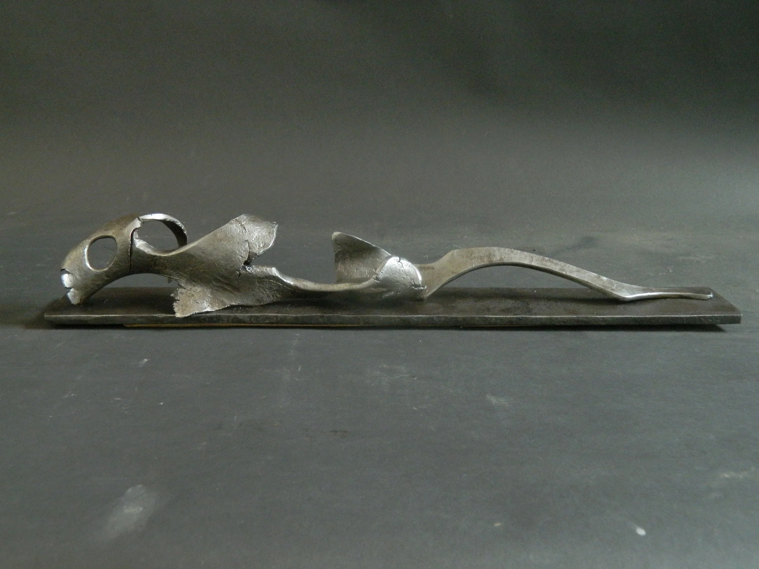 Reclining - 17 X 3 " in wrought Iron, by Lee Sauder