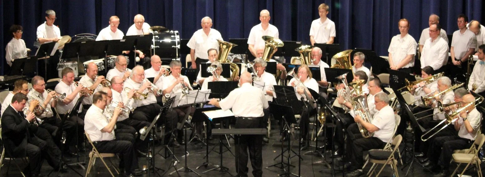 Mr. Bernie Pitkin directs the Brass Band playing our National Anthem