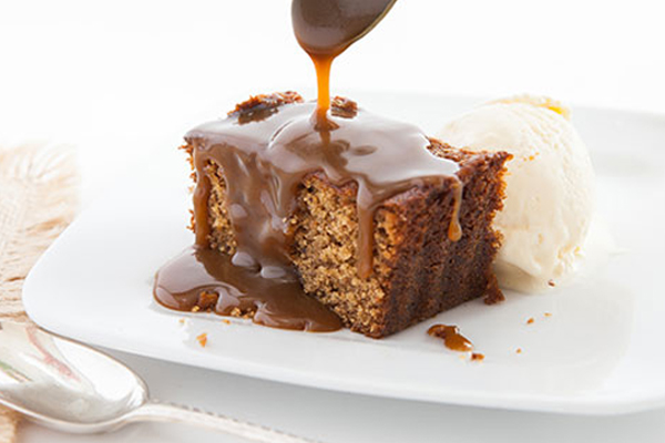 Sticky Toffee Pudding A buttery date sponge pudding smothered with lashings of rich toffee sauce.