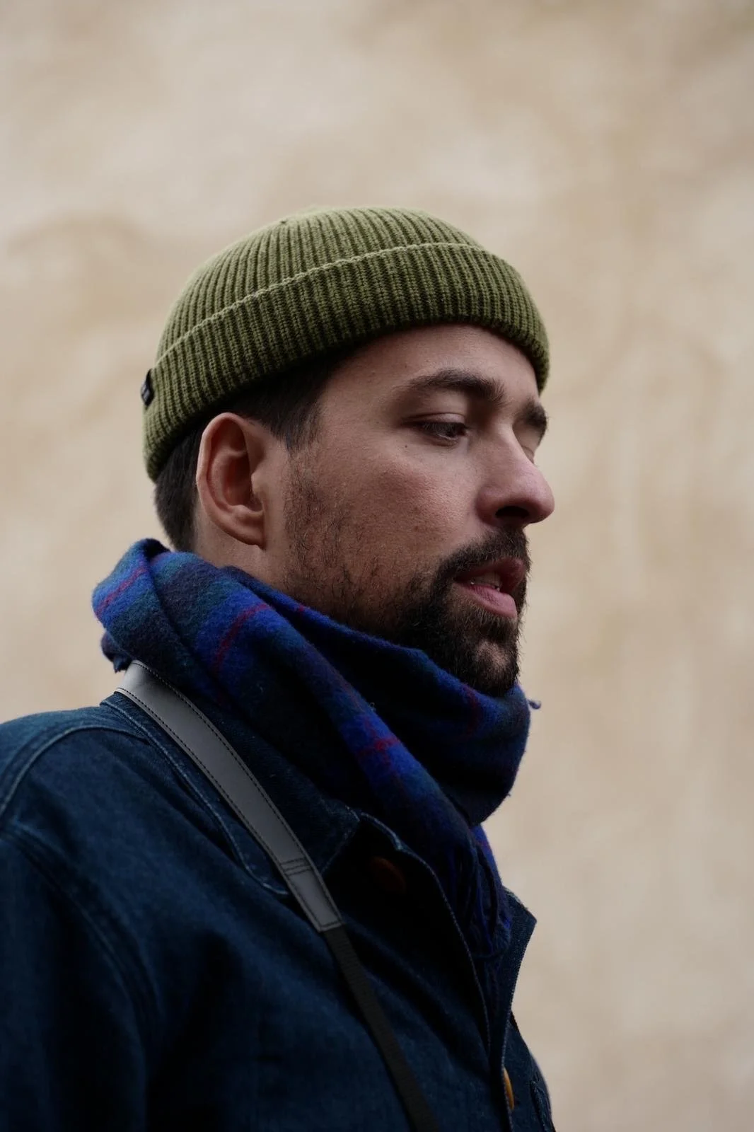 Image of the designer of the website on the its right side looking down.