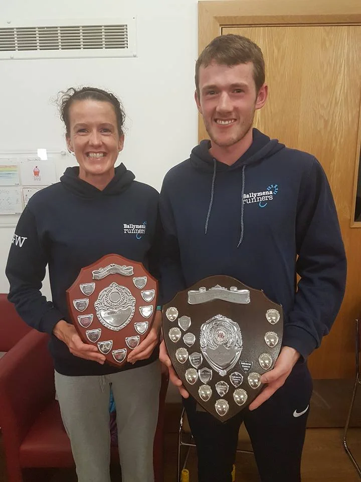 Gillian Wasson and James Hamilton display the Inter-Club Ladies and Men's Team Shields