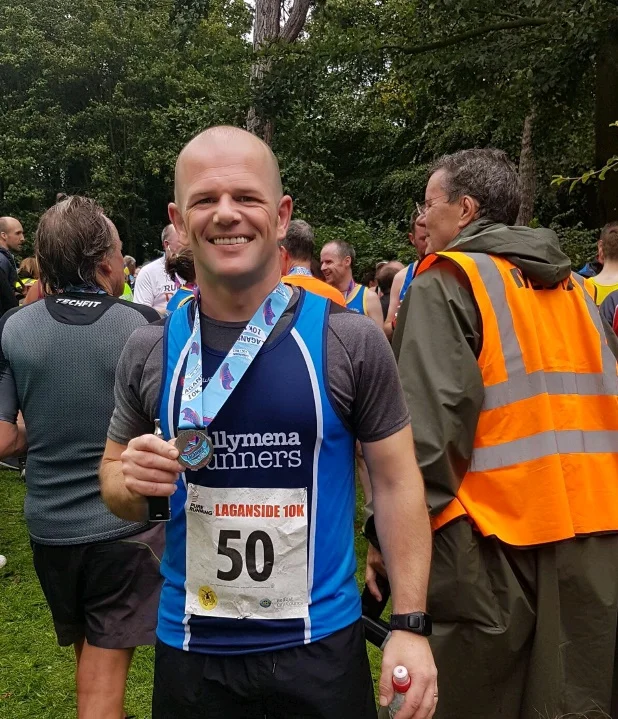 Chris Davies celebrates his PB at the Laganside 10k