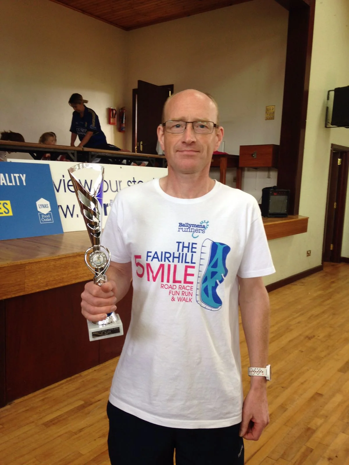 James Turtle displays his Rasharkin 5k trophy
