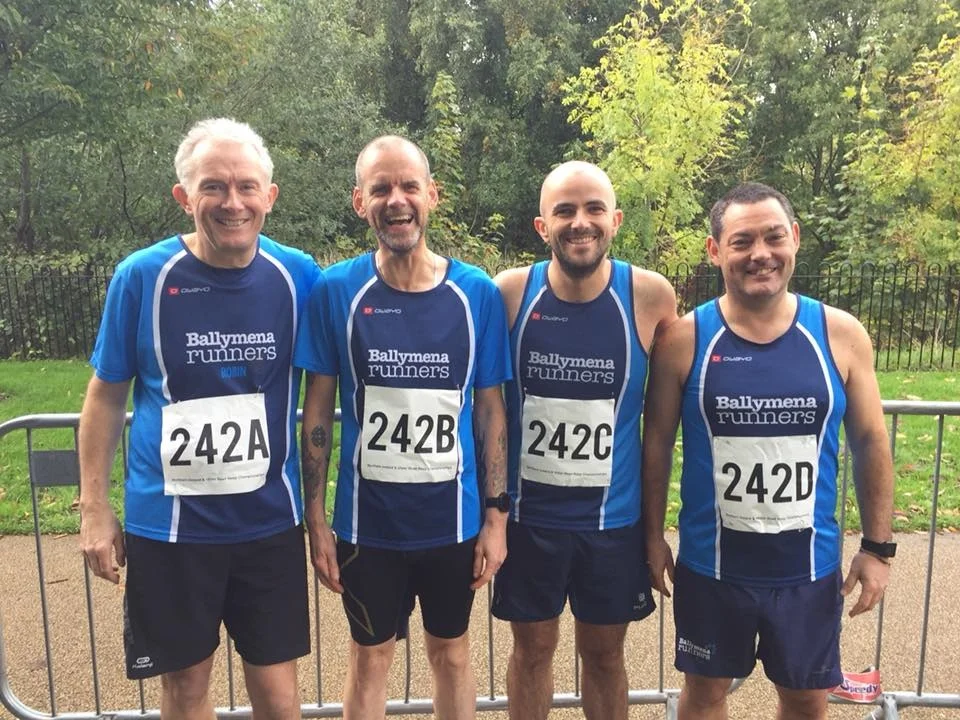 Robin Alexander, John Robinson, Chris Young and Alastair Donaghy form a very orderly queue at the NI Road Relay Championships!