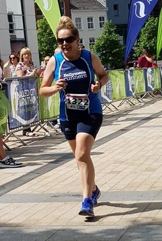 Serena McCartney approaches the finish of the Walled City Marathon