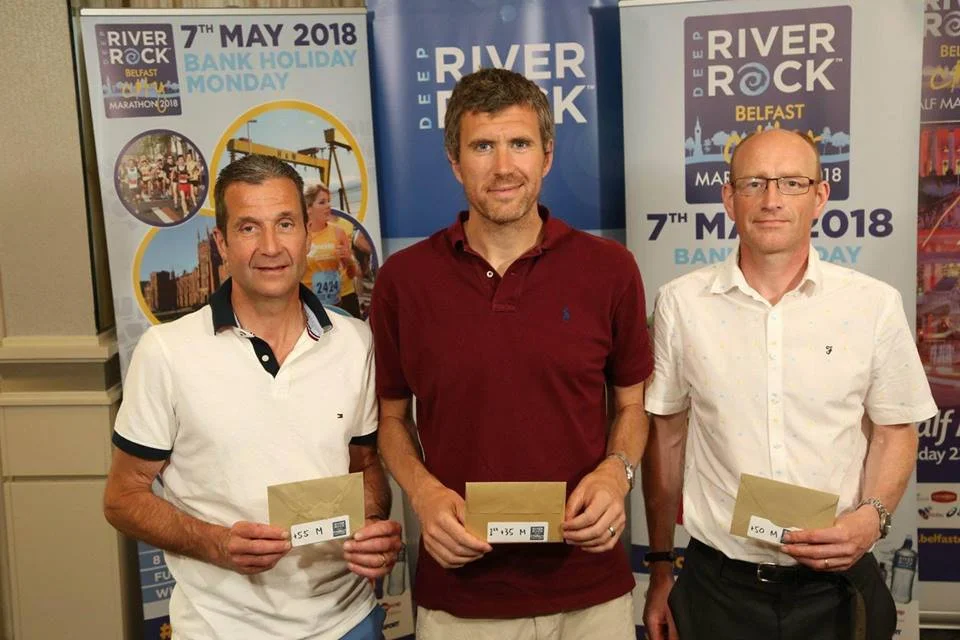 Noel Connor, Ben Morrow and James Turtle with their age category prizes from the recent Belfast City Marathon