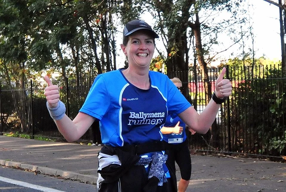 Thumbs up from Iverene Carleton on her way to a PB at the Belfast Half Marathon