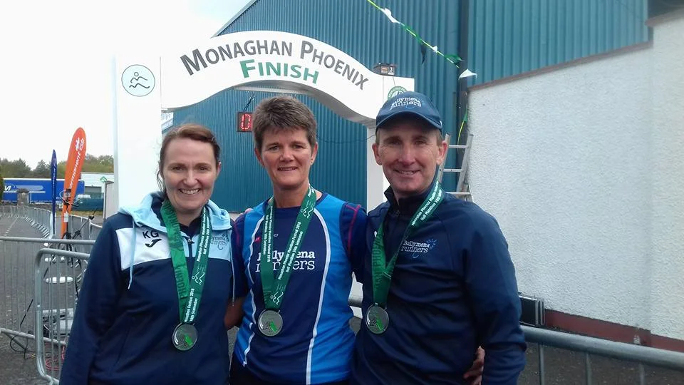 Kathryn Grant, Linda Petticrew and Rodney Agnew display their medals from the Monaghan Half Marathon