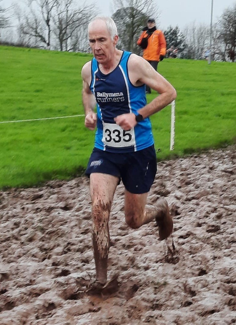 John Hasson braving the mud at Irwin Speers XC.jpg