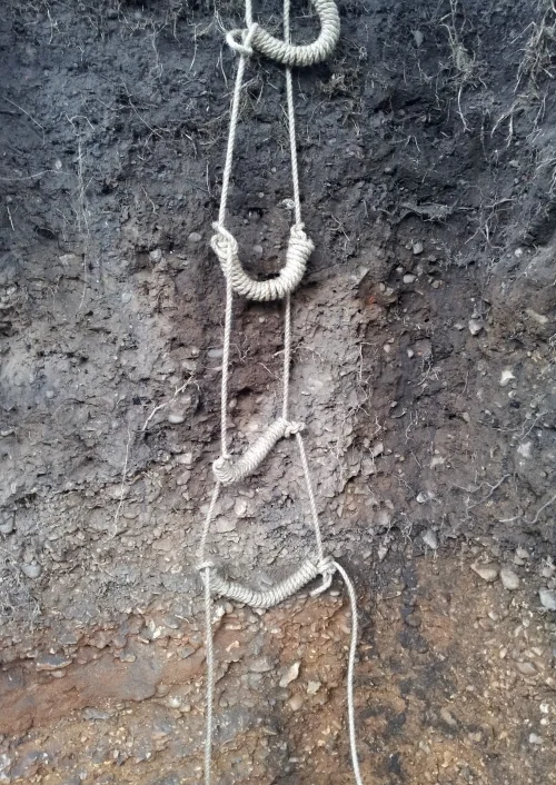 Rope ladder made by visitors to the hole as a means of egress.