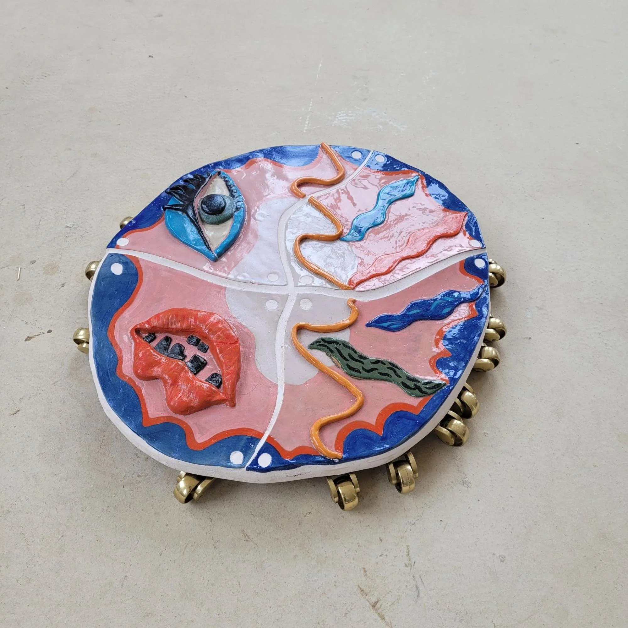 Chilopoda, 2022, shown at The Hide Installation and Sculpture Show, 2022, and Fat Rascals, St Anne's House, 2023. Glazed ceramic, wood, casters.