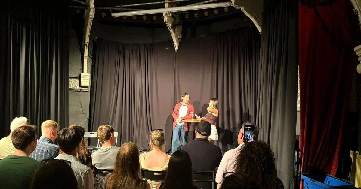 Audience watching Greg Corrigan and Mia perform a scene at a Manchester Actors Studio showcase at The Kings Arms Theatre in Salford.