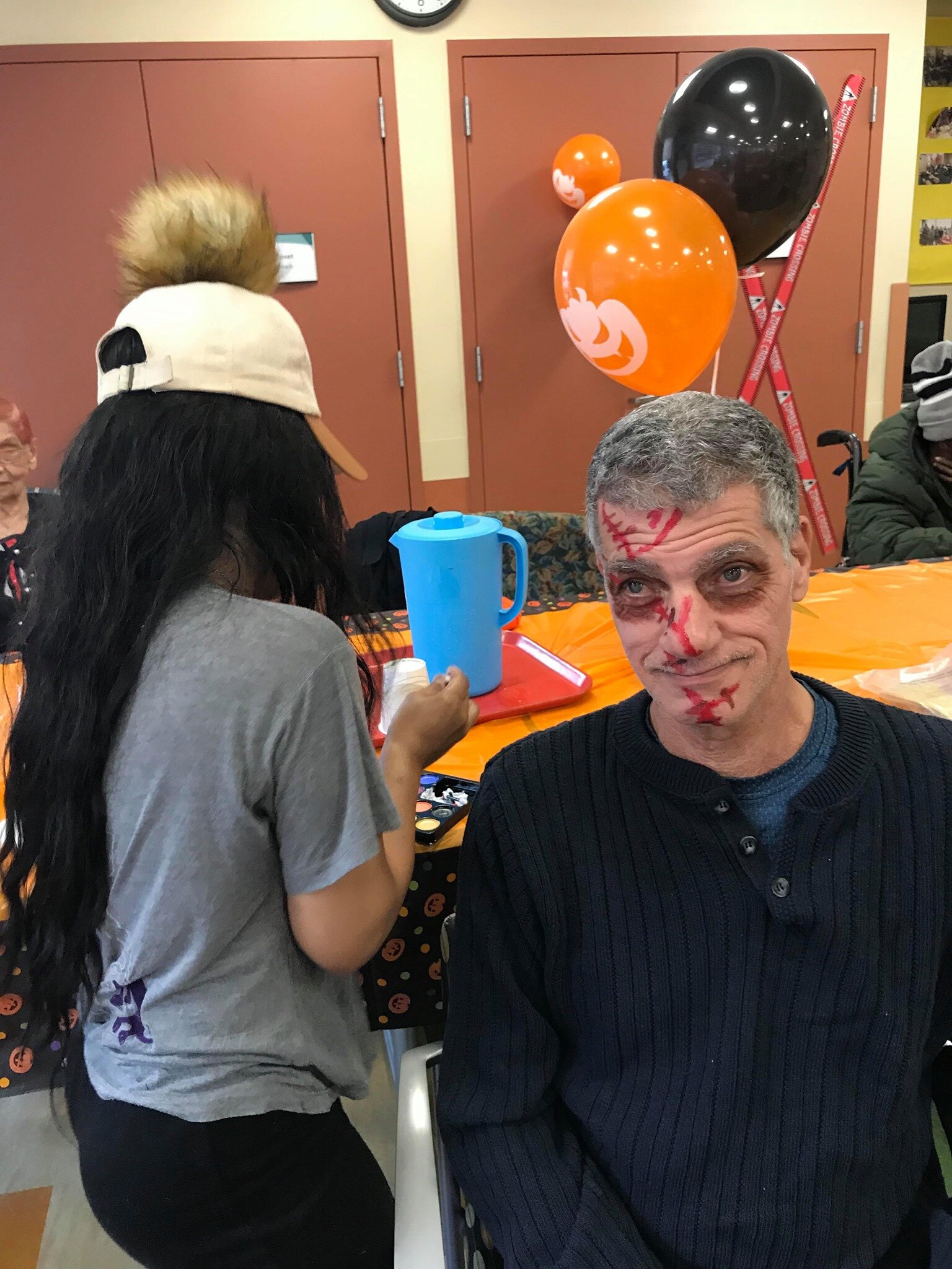 participant having his face painted