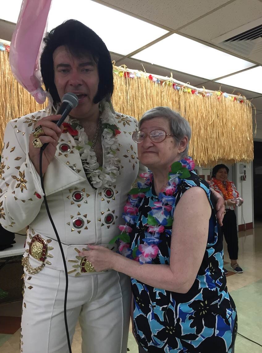 Elvis impersonator with participant