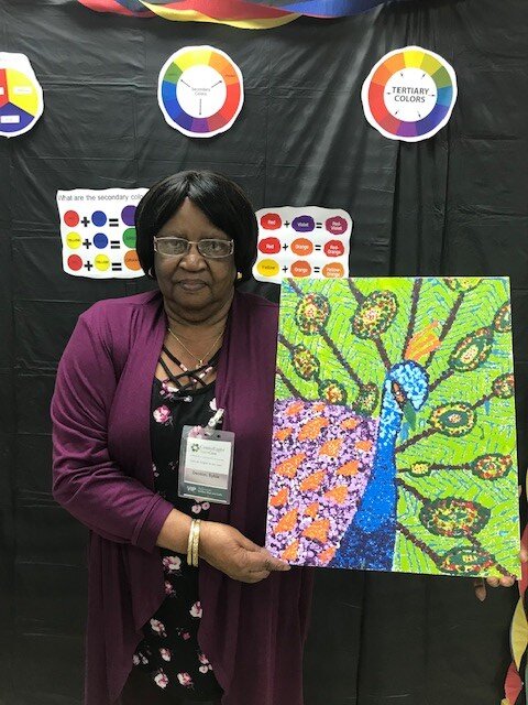 2nd participant holding artwork