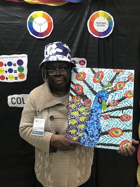 another participant holding artwork