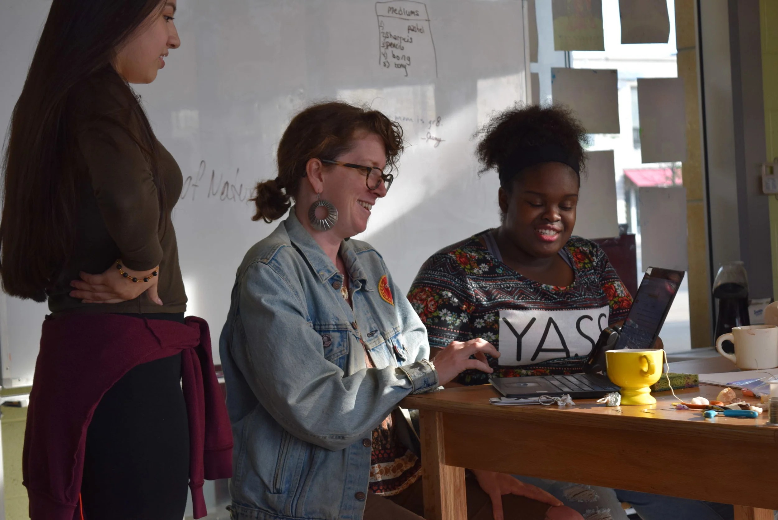 Teaching Artist Maggie McGuire works with teens on social media videos in our Out-of-School Arts Program. 
