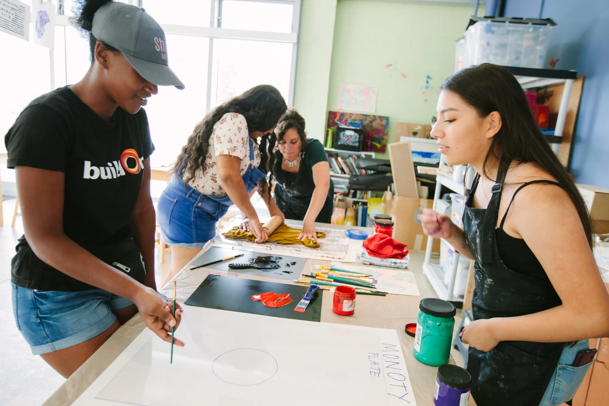 Students in a printmaking workshop at Open Arts Fest led by Director of Programs, Erika Villarreal Bunce.