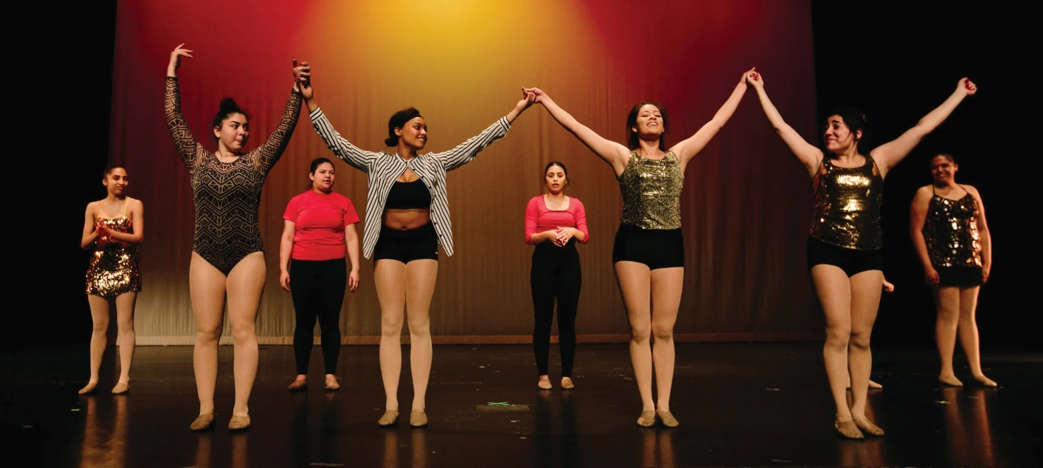 Senior dancers (front row, L-R) Andrea Hinojosa, Alexis Harris, Xalma Palomino, and Carolina Anaya, perform with the Youth Dance Ensemble at the 2019 Annual Student Showcase at Cass Technical High School.