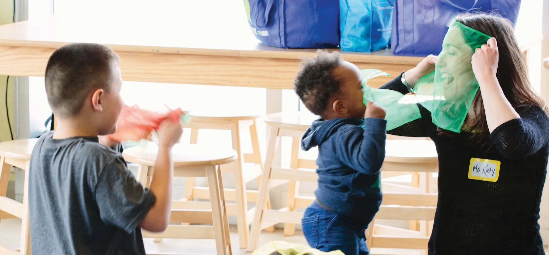 Teaching Artist Katy Schoetzow with toddlers in a Detroit Wolf Trap family class.