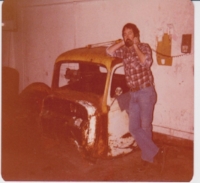 My dad, a business owner who preferred writing on walls. (Those are pencil marks behind him). I inherited both traits. 