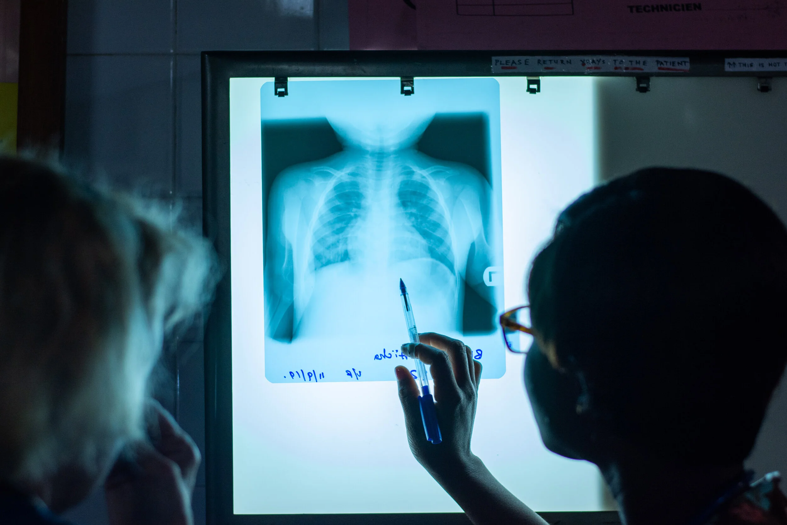 Reading the x-rays of a pediatric patient.