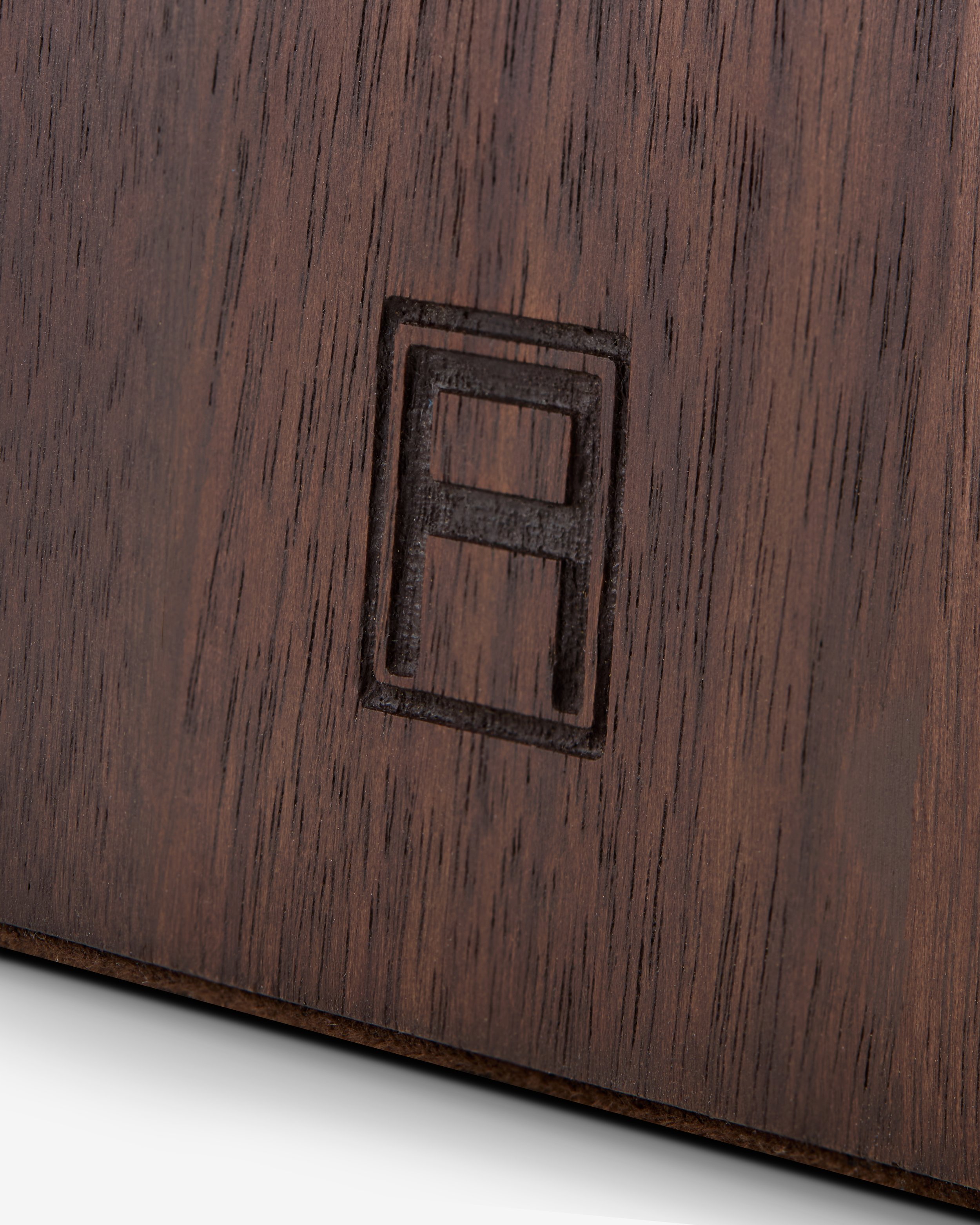 Library Collection_Library Bookends_Walnut Wood Brass_Logo Detail_Assouline_2025.jpeg