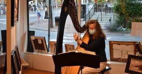 Suki Flanagan plays harp.