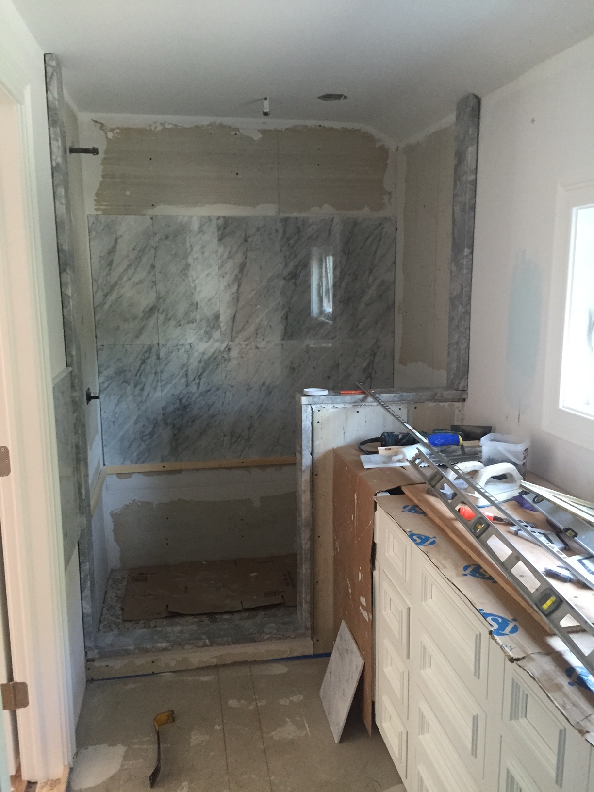 Cabinets are in, marble being placed 
