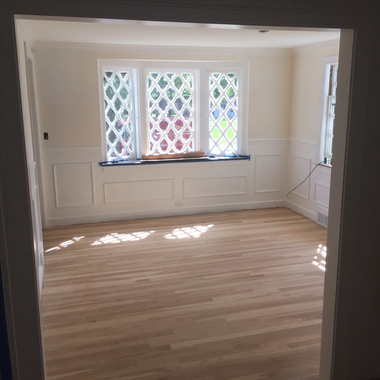 Time to brighten it up! I painted all the windows white. New chair rails and moulding.