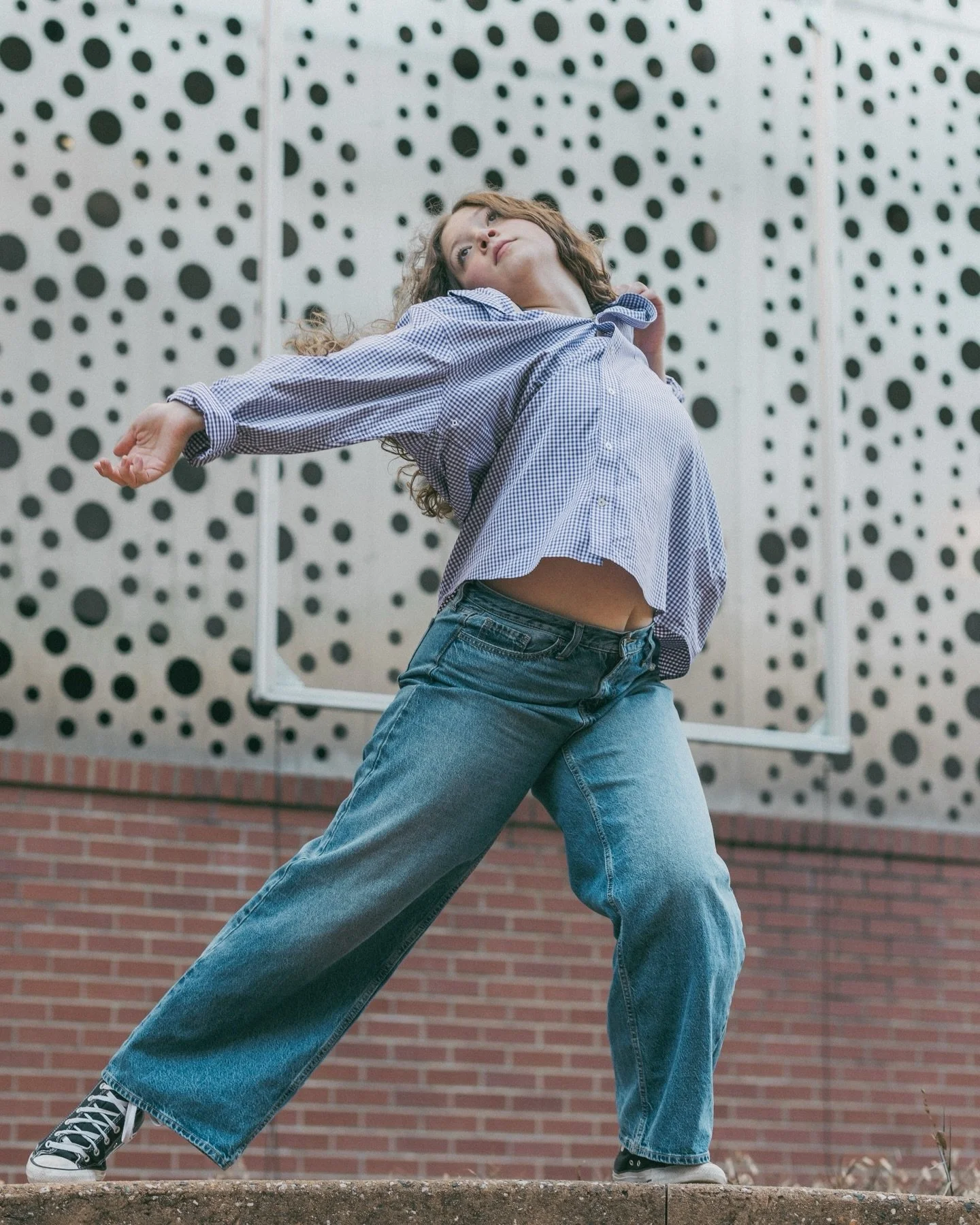 Observing architecture with Lily. 🏙️

&mdash;
#ncdance #ncphotographer #creativeportraits #incameraeffects #dancephotography