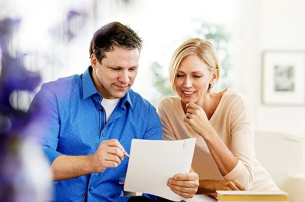 Couple-doing-paperwork-at-home.jpg