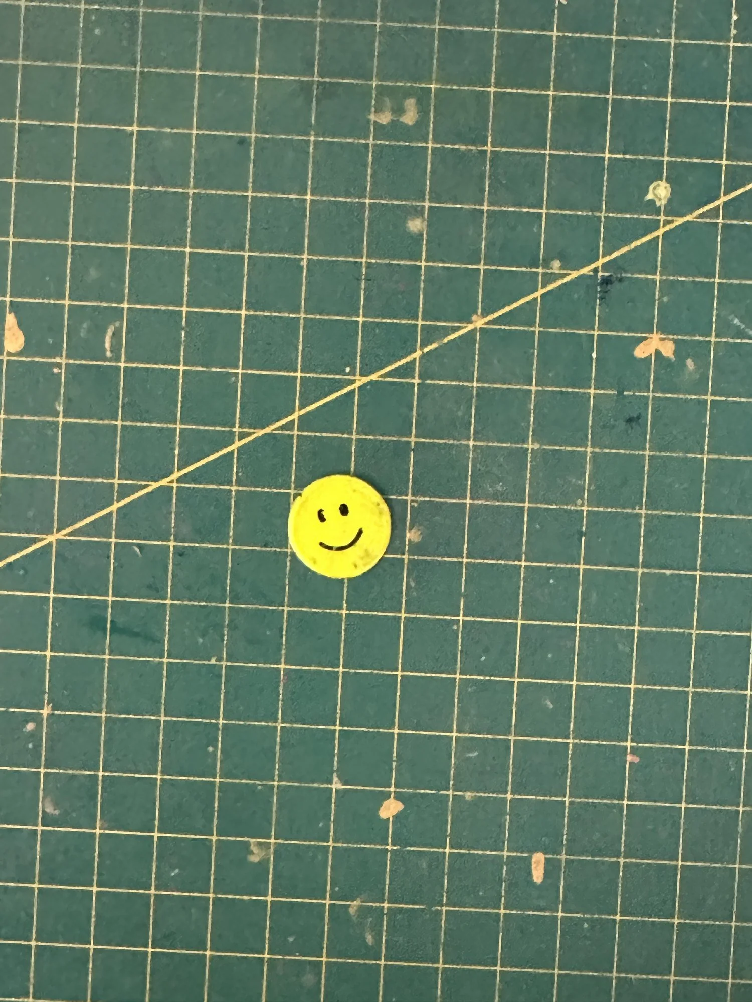 A smiley face token wedged down the back