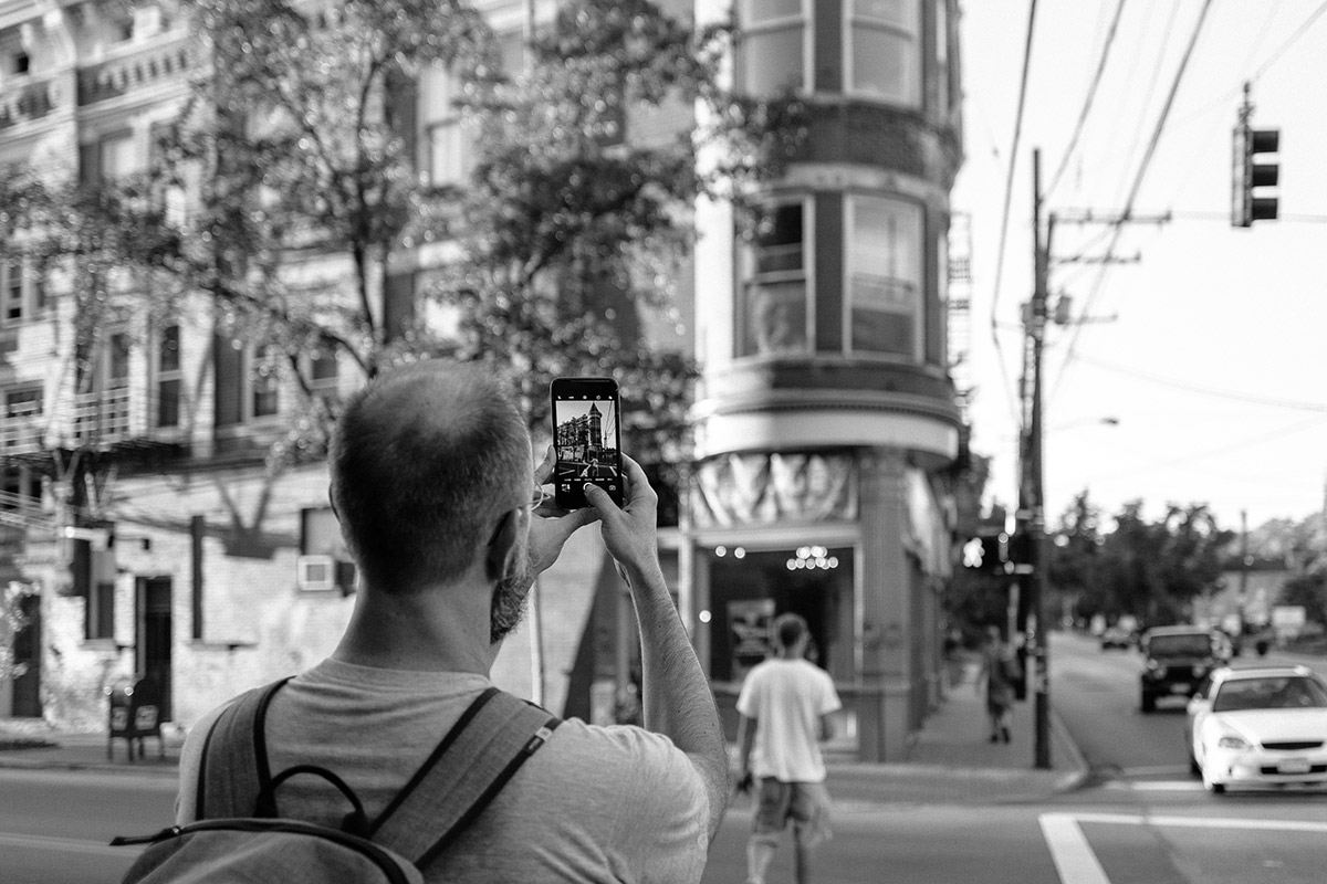 Chris Glass photographing in Northside Photo by Casey Wadlow