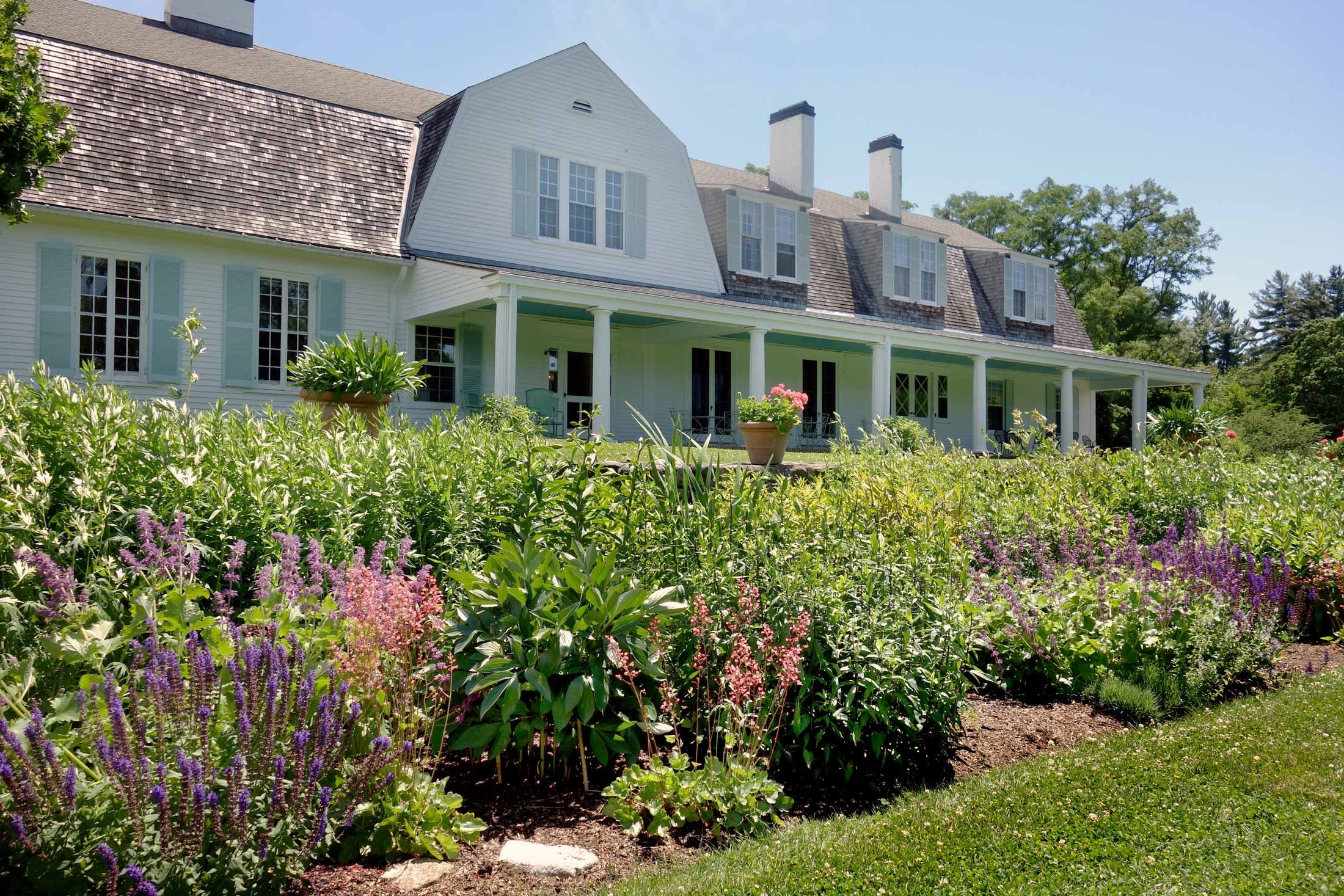 The Fells Main House and Veranda with Perennial Border in foreground.