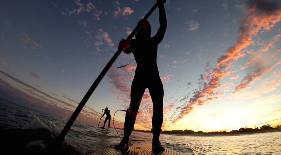 Jessica Cichra paddleboarding sunset