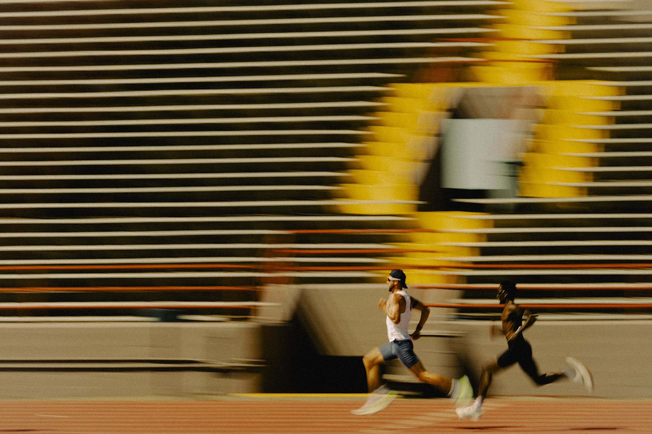 Josh Kerr running intervals at a track in New Mexico