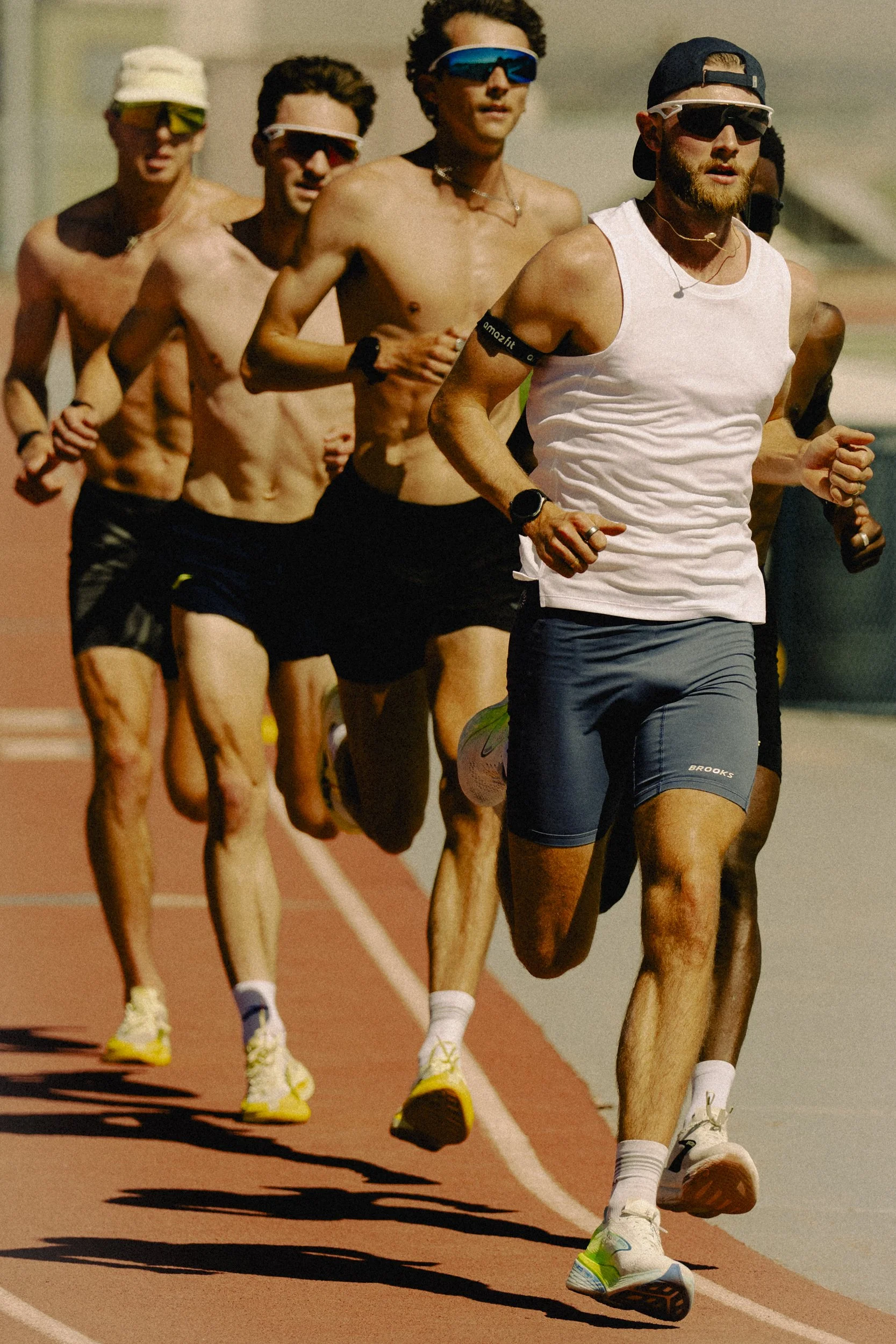 Josh Kerr and the Brooks beasts running laps on a track in New Mexico