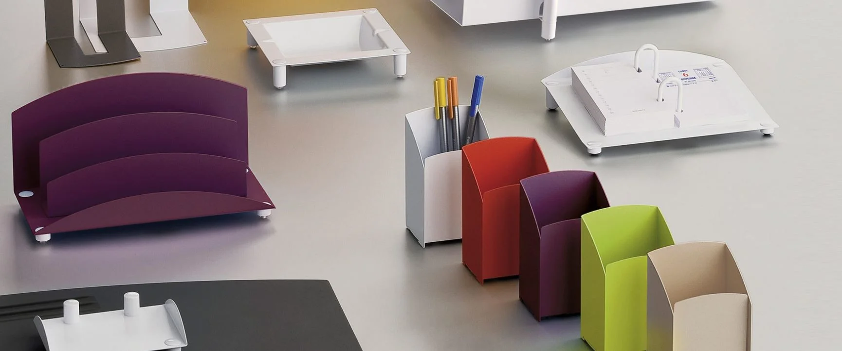 Accessories can be everything. Magnuson Group offers desk accessories from their Axiane line, which includes a violet finish option.