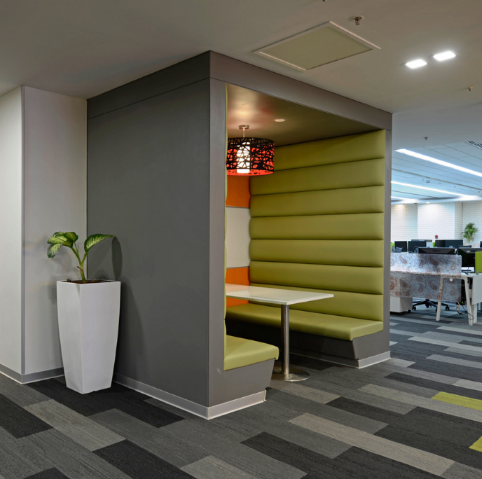 The semi-private space is typically designed with furniture pieces that have higher partions and acoustical properties.