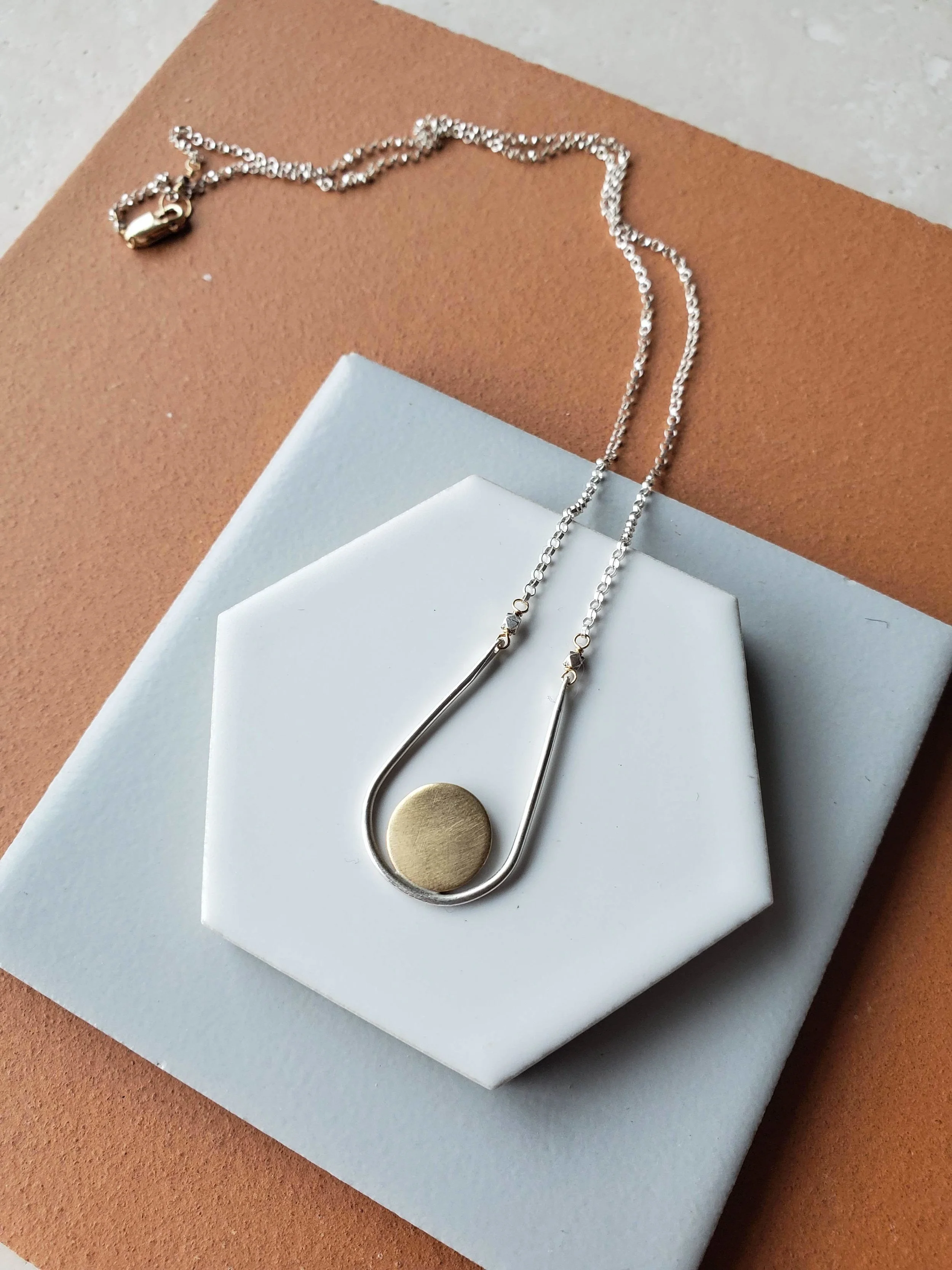 Sunset necklace in silver and brass