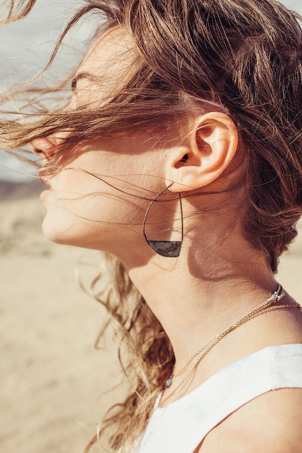 Beautiful woman wearing Klatch earrings