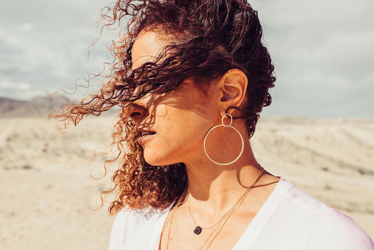 Woman wearing black onyx necklace