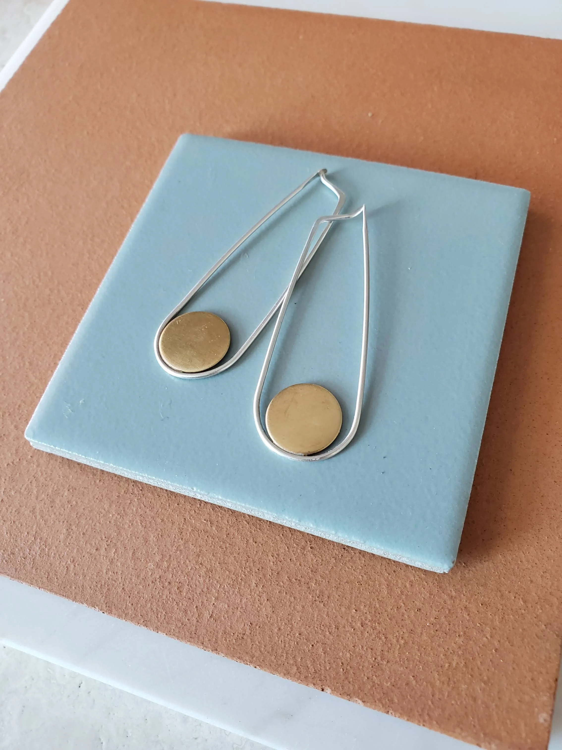 Long drop earrings with geometric detail in sterling silver