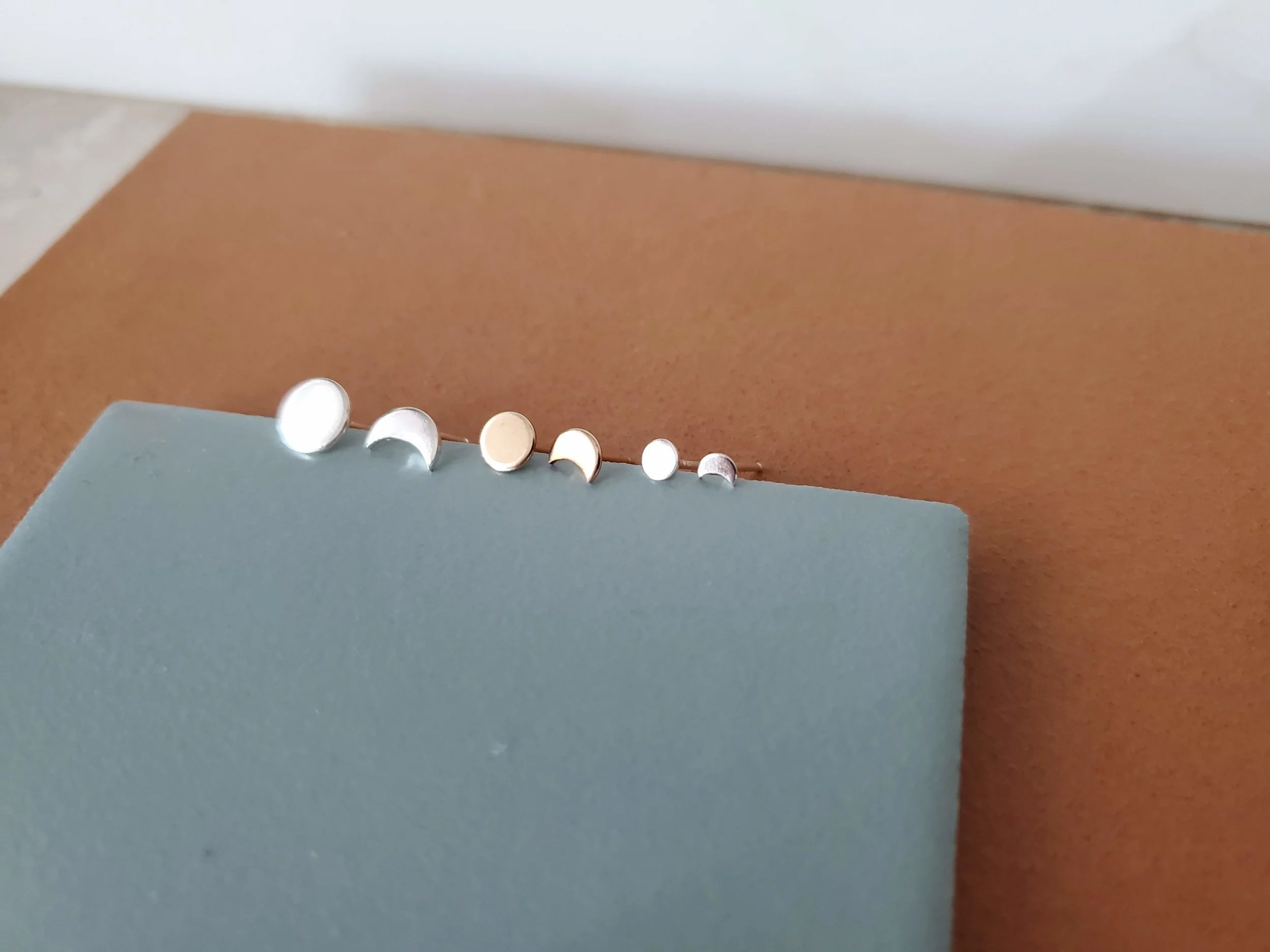 three tiny moon post stud earrings