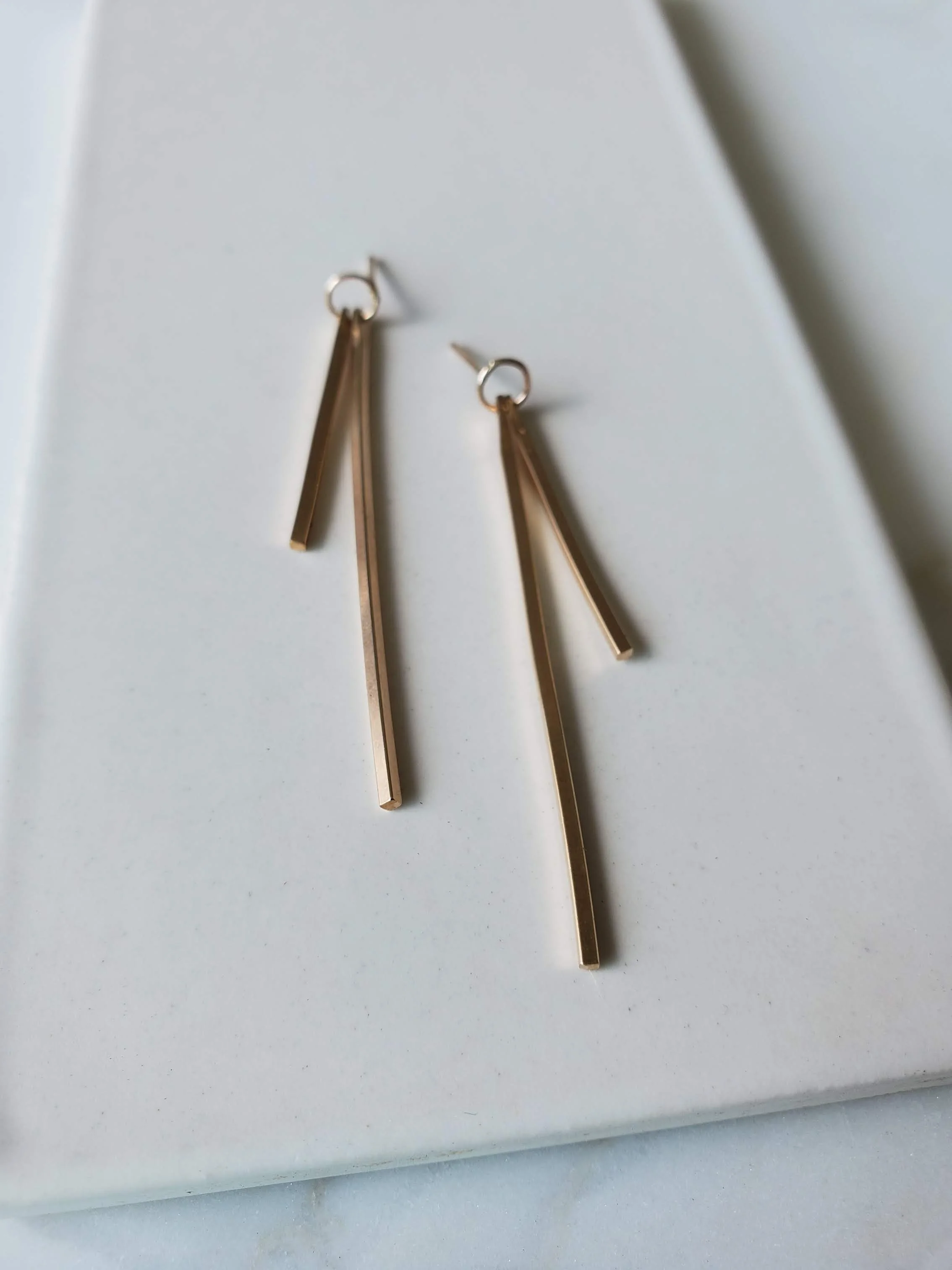 gold stick dangle earrings